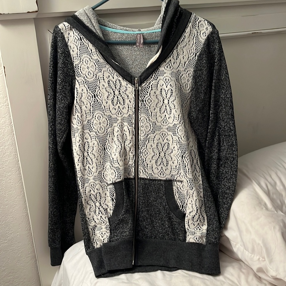 Vanity brand size large. Dark grey zip up jacket with cream color lace front.